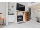 Living room featuring a fireplace, built-in shelving, and a staircase to the upper level at 4396 Baldwin Ave. # 94, Little River, SC 29566