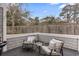 Inviting patio area with outdoor seating, offering a peaceful retreat with a wooden fence backdrop at 4396 Baldwin Ave. # 94, Little River, SC 29566