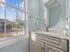 Bathroom with vanity and sink featuring a decorative mirror and large bright window at 455 Blackberry Ln., Myrtle Beach, SC 29579