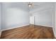 Spacious bedroom featuring wood floors, a ceiling fan, and a light blue painted wall at 455 Blackberry Ln., Myrtle Beach, SC 29579