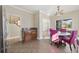 Cozy dining area with a marble-topped table, plush chairs, and tile flooring at 455 Blackberry Ln., Myrtle Beach, SC 29579