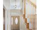 Bright foyer with wood flooring, staircase, and decorative front door with sidelights at 455 Blackberry Ln., Myrtle Beach, SC 29579