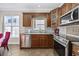 The well-equipped kitchen features wooden cabinetry and stainless steel appliances at 455 Blackberry Ln., Myrtle Beach, SC 29579