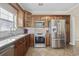 Well-lit kitchen features stainless appliances, tiled backsplash, and granite countertops at 455 Blackberry Ln., Myrtle Beach, SC 29579