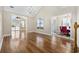 Open-concept living room with hardwood floors and a vaulted ceiling leads to dining and outdoor spaces at 455 Blackberry Ln., Myrtle Beach, SC 29579