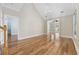 Bright living room with wood flooring, a view of another room, and abundant natural light at 455 Blackberry Ln., Myrtle Beach, SC 29579