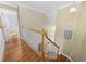 Stairway and hallway with white banister and wooden stairs and flooring at 455 Blackberry Ln., Myrtle Beach, SC 29579