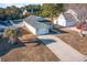 Aerial view of the property showcasing the home's exterior, driveway, and well-maintained surroundings at 4783 Southgate Pkwy., Myrtle Beach, SC 29579