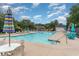 Community swimming pool with lounge chairs and umbrellas, offering a relaxing recreational space at 4783 Southgate Pkwy., Myrtle Beach, SC 29579