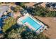 Aerial view of a large community pool surrounded by trees, lounge chairs, and a recreation area at 4783 Southgate Pkwy., Myrtle Beach, SC 29579