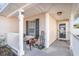 Inviting front porch with a welcome sign and a chair at 4783 Southgate Pkwy., Myrtle Beach, SC 29579