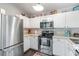 Modern kitchen with stainless steel appliances and white cabinets at 4783 Southgate Pkwy., Myrtle Beach, SC 29579