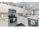 Well-equipped kitchen with stainless steel appliances and white cabinets at 4783 Southgate Pkwy., Myrtle Beach, SC 29579