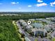 Scenic aerial view of condo community with a lake, lush trees and coastal views at 4851 Luster Leaf Circle # 302, Myrtle Beach, SC 29577