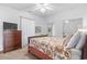 Inviting bedroom showcasing a beautifully decorated bed, mirrored closet doors, and carpet flooring at 4851 Luster Leaf Circle # 302, Myrtle Beach, SC 29577