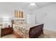 Cozy bedroom featuring a decorated bed, carpet flooring, and minimalist decor with a nightstand at 4851 Luster Leaf Circle # 302, Myrtle Beach, SC 29577