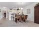 Charming dining area with seating for six, stylish chandelier, and adjacent breakfast bar with kitchen access at 4851 Luster Leaf Circle # 302, Myrtle Beach, SC 29577