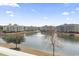 Scenic view of a lake surrounded by residential buildings on a sunny day at 4851 Luster Leaf Circle # 302, Myrtle Beach, SC 29577