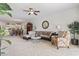 Spacious living room with modern furniture, a ceiling fan, and an open layout to the kitchen and dining area at 4851 Luster Leaf Circle # 302, Myrtle Beach, SC 29577