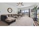 Open living area with large sectional sofa, balcony access, and a glimpse of the community view at 4851 Luster Leaf Circle # 302, Myrtle Beach, SC 29577