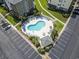 Aerial shot of the community pool and lounge area, adjacent to parking and landscaping at 4851 Luster Leaf Circle # 302, Myrtle Beach, SC 29577