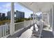 Expansive covered balcony offering views of the water and distant buildings at 4904 Salt Creek Ct., North Myrtle Beach, SC 29582