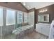 This bathroom features a soaking tub, tiled floors, and frosted window to give you an abundance of natural light at 4904 Salt Creek Ct., North Myrtle Beach, SC 29582