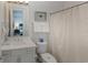 This bathroom is all-white with a shower/tub combo and a large mirror to help you get ready in the morning at 4904 Salt Creek Ct., North Myrtle Beach, SC 29582