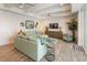 Coastal living room with a large sectional sofa, wood floors, and modern decor at 4904 Salt Creek Ct., North Myrtle Beach, SC 29582