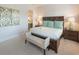 This main bedroom has a king bed, two night stands, a bench, and decor that ties the room together at 4904 Salt Creek Ct., North Myrtle Beach, SC 29582