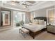 The main bedroom has a luxurious bed and views to the sitting area at 4904 Salt Creek Ct., North Myrtle Beach, SC 29582