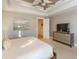 The main bedroom with tray ceiling includes a TV and an en suite at 4904 Salt Creek Ct., North Myrtle Beach, SC 29582