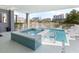 Relaxing outdoor pool with hot tub, complemented by a spacious patio and city skyline at 4904 Salt Creek Ct., North Myrtle Beach, SC 29582