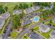 Aerial view of neighborhood condos near a pool, with mature trees and sidewalks throughout at 4933 Crab Pond Ct. # 202, Myrtle Beach, SC 29579