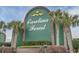 Carolina Forest community sign featuring white lettering and a brick base, surrounded by manicured landscaping at 4933 Crab Pond Ct. # 202, Myrtle Beach, SC 29579