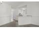 Cozy dining area with neutral tones and trim work, seamlessly flowing into the adjacent kitchen space at 4933 Crab Pond Ct. # 202, Myrtle Beach, SC 29579