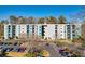 Apartment building featuring multiple stories, parking, and colorful blue and white exterior at 5001 Little River Rd. # W-214, Myrtle Beach, SC 29577