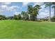 Expansive golf course view showcases meticulously maintained green and towering trees under a bright sky at 600 Barona Dr., Myrtle Beach, SC 29579