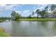 Scenic pond view showcases lush green golf course, foot bridge and blue skies creating a tranquil scene at 600 Barona Dr., Myrtle Beach, SC 29579