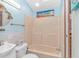 Clean bathroom with light blue walls, tub/shower combo, and white vanity at 6001-6012 S Kings Hwy., Myrtle Beach, SC 29575