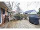 Spacious wooden deck featuring outdoor seating and a grill, perfect for backyard relaxation and gatherings at 604 Six Lakes Dr., Myrtle Beach, SC 29588