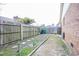 Backyard view featuring a fenced yard with garden beds, offering a private outdoor space at 604 Six Lakes Dr., Myrtle Beach, SC 29588