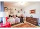 Cozy bedroom showcasing a comfortable bed, dresser, and decorative shelves with accents at 604 Six Lakes Dr., Myrtle Beach, SC 29588