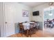 Cozy dining area with wood table and view of the kitchen and living spaces at 604 Six Lakes Dr., Myrtle Beach, SC 29588