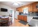 Kitchen featuring wood cabinets, appliances, and adjacent breakfast nook at 604 Six Lakes Dr., Myrtle Beach, SC 29588