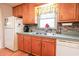 Well-lit kitchen area with wooden cabinetry and modern appliances at 604 Six Lakes Dr., Myrtle Beach, SC 29588