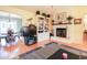 Cozy living room view with fireplace, built-in shelving, and dining area beyond at 604 Six Lakes Dr., Myrtle Beach, SC 29588