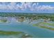 Wide aerial view of waterfront community with marina, surrounding marshland, and ocean access at 6208 Sweetwater Blvd. # 6208, Murrells Inlet, SC 29576