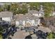 Aerial view of complex showing nearby trees, lawns, community pool and ample parking at 6208 Sweetwater Blvd. # 6208, Murrells Inlet, SC 29576