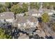 Aerial view of complex with parking lot, manicured lawns, community pool and surrounding trees at 6208 Sweetwater Blvd. # 6208, Murrells Inlet, SC 29576